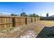 Spacious backyard enclosed by a wooden fence at 7430 Buchanan Dr, Port Richey, FL 34668