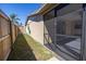 Side yard with screened enclosure at 7430 Buchanan Dr, Port Richey, FL 34668