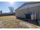 Backyard with AC unit and water softener at 7430 Buchanan Dr, Port Richey, FL 34668