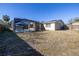 Fenced backyard with a view of the pool at 7430 Buchanan Dr, Port Richey, FL 34668