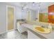 Bright bathroom with double vanity and a large mirror at 7430 Buchanan Dr, Port Richey, FL 34668