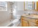 Bathroom with shower, toilet and vanity at 7430 Buchanan Dr, Port Richey, FL 34668