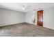 Bright bedroom with carpet and access to bathroom at 7430 Buchanan Dr, Port Richey, FL 34668