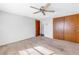 Spacious bedroom with carpet flooring and double door closet at 7430 Buchanan Dr, Port Richey, FL 34668