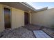 Front entry with decorative stone pathway and exterior lighting at 7430 Buchanan Dr, Port Richey, FL 34668
