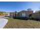 Single-story home with a fenced backyard and a shed at 7430 Buchanan Dr, Port Richey, FL 34668