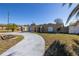 Single story home with a curved driveway and a large yard at 7430 Buchanan Dr, Port Richey, FL 34668