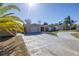 Single-story house with a two car garage and a long driveway at 7430 Buchanan Dr, Port Richey, FL 34668