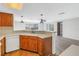 Kitchen features a dishwasher, wood cabinets, and corner sink at 7430 Buchanan Dr, Port Richey, FL 34668