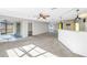 Open concept kitchen and living room with access to patio at 7430 Buchanan Dr, Port Richey, FL 34668