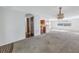 Open concept living room with a view of the kitchen at 7430 Buchanan Dr, Port Richey, FL 34668