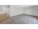 Open living room showcasing neutral decor and carpet at 7430 Buchanan Dr, Port Richey, FL 34668