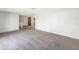 Spacious living area with neutral walls and carpet at 7430 Buchanan Dr, Port Richey, FL 34668