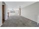 Spacious living room featuring neutral walls and plush carpeting at 7430 Buchanan Dr, Port Richey, FL 34668