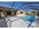 Inviting pool area with covered patio, ideal for relaxation and entertainment at 7430 Buchanan Dr, Port Richey, FL 34668