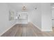 Spacious living room with light grey walls and wood-look flooring at 1000 49Th N St # 214, St Petersburg, FL 33710