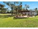 Large backyard with a pergola and patio area at 11305 Sweet Bay Ct, Riverview, FL 33569
