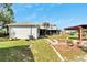 Spacious backyard with firepit, pergola, and shed at 11305 Sweet Bay Ct, Riverview, FL 33569