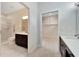 Bathroom with double vanity, large closet, and shower at 11305 Sweet Bay Ct, Riverview, FL 33569