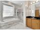 Bathroom with a walk-in shower, soaking tub, and double vanity at 11305 Sweet Bay Ct, Riverview, FL 33569