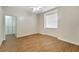 Light and airy bedroom with wood-look tile floors and window coverings at 11305 Sweet Bay Ct, Riverview, FL 33569