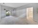 Bedroom with sliding glass doors leading to backyard at 11305 Sweet Bay Ct, Riverview, FL 33569