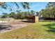 Chicken coop with covered enclosure in the backyard at 11305 Sweet Bay Ct, Riverview, FL 33569
