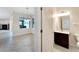 Convenient half bathroom with dark vanity and tile floor at 11305 Sweet Bay Ct, Riverview, FL 33569