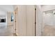 Bright hallway with tile flooring and access to several rooms at 11305 Sweet Bay Ct, Riverview, FL 33569