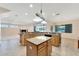 Open kitchen with island and views to backyard at 11305 Sweet Bay Ct, Riverview, FL 33569