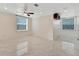 Spacious living area with large windows and marble-look floors at 11305 Sweet Bay Ct, Riverview, FL 33569