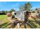 Additional storage shed with a window and covered area at 11305 Sweet Bay Ct, Riverview, FL 33569