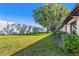 Private backyard with grassy area and trees at 13250 Ridge Rd # 2-1, Largo, FL 33778