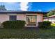 Backyard view with sliding glass door access at 13250 Ridge Rd # 2-1, Largo, FL 33778