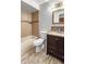 Updated bathroom with a tub, toilet and vanity at 13250 Ridge Rd # 2-1, Largo, FL 33778