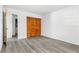 Bedroom with closet and light-grey wood-look flooring at 13250 Ridge Rd # 2-1, Largo, FL 33778