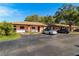 Exterior view of building showing parking and landscaping at 13250 Ridge Rd # 2-1, Largo, FL 33778