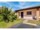 Exterior view of condo with parking and landscaping at 13250 Ridge Rd # 2-1, Largo, FL 33778