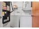 Laundry closet with washer, dryer and shelving at 13250 Ridge Rd # 2-1, Largo, FL 33778
