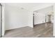 Bright living room with light-grey wood-look flooring and open layout at 13250 Ridge Rd # 2-1, Largo, FL 33778