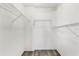 A walk-in closet with wood-look flooring and several adjustable wire shelves for storage at 13250 Ridge Rd # 2-1, Largo, FL 33778