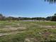 Scenic backyard view featuring a tranquil pond surrounded by lush greenery at 3960 Headsail Dr, New Port Richey, FL 34652