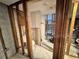 Bathroom in progress displaying stud framing, toilet, and tile flooring with in-progress shower at 3960 Headsail Dr, New Port Richey, FL 34652