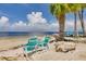Beach with turquoise chairs and ocean view at 3960 Headsail Dr, New Port Richey, FL 34652