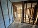 Hallway featuring framing, tile flooring, ready for renovation and customization, open layout, and great potential at 3960 Headsail Dr, New Port Richey, FL 34652