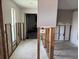 Hallway with tiled flooring, showcasing potential for renovation and customization leading to a garage at 3960 Headsail Dr, New Port Richey, FL 34652