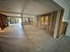 Spacious unfinished room showcasing tile flooring and renovation potential with natural light, ready for customization at 3960 Headsail Dr, New Port Richey, FL 34652