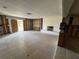 Living room features tile floors, a brick fireplace and natural light from windows and sliding door at 3960 Headsail Dr, New Port Richey, FL 34652