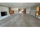Large living room with fireplace and open design, ready for renovation and personalization with tile flooring at 3960 Headsail Dr, New Port Richey, FL 34652
