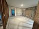 An empty room torn down to the studs, concrete floor, and exposed block wall at 3960 Headsail Dr, New Port Richey, FL 34652